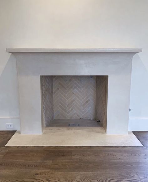 Precast Stone Fireplace, Herringbone Stone Fireplace, Indoor Fireplace Tile Ideas, Solid Stone Fireplace, Plaster And Tile Fireplace, Herringbone Tiles Fireplace, Herringbone Tiled Fireplace, Concrete Mantle Fireplace, Plaster Fireplace Mantle