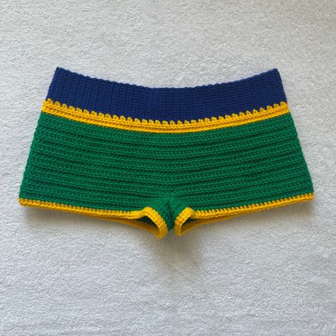 🇧🇷Hand crocheted Brazil Flag Shorts, Blue and Green summer Mini Shorts with 2 Yellow stripes. Please note that these shorts are mini shorts, if you message me I can adjust the length to make them slightly shorter or longer. 🇧🇷 🇧🇷The shorts waist band is made with a soft blue yarn and hugs your waist but is stretchable. The body of the shorts are made with a soft green yarn and a two stripes made with a soft yellow yarn. 🇧🇷 🇧🇷The shorts in the picture are a size   Small. 🇧🇷 Shorts Beach Outfit, Dreamy Wardrobe, Shorts Y2k, Yellow Yarn, Green Yarn, Brazil Flag, Crochet Short, Earthy Outfits, Crochet Shorts