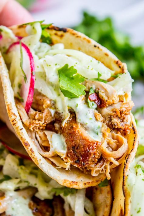 Slow Cooker Pork Tacos with Mexican Coleslaw from The Food Charlatan. The juiciest Slow Cooker Pork Tacos! No marinating, just make a simple spice rub and toss it in the crock pot. So easy. Then top it off with a homemade Mexican coleslaw that you are going to LOVE! #tacos #slowcooker #pork #porktacos #pulledporktacos #Mexican #Mexicanfood #corntortillas #coleslaw #cabbage #crockpot #easy #recipe #radish Pork Tacos Slow Cooker, Mexican Coleslaw Recipe, Tacos Slow Cooker, Mexican Coleslaw, Slow Cooker Pork Tacos, The Food Charlatan, Pulled Pork Tacos, Homemade Mexican, Food Charlatan