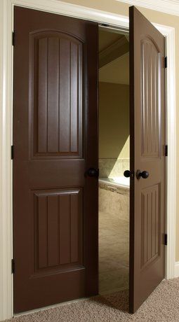 Dark stained interior wood doors including french doors leading into the dining room and formal living room. Wood Door Paint Ideas, Dark Brown Doors Interior, Brown Doors Interior, Brown Interior Doors, Rustic Entry Doors, Interior Glazed Doors, Solid Core Interior Doors, Painted Interior Doors, White Molding