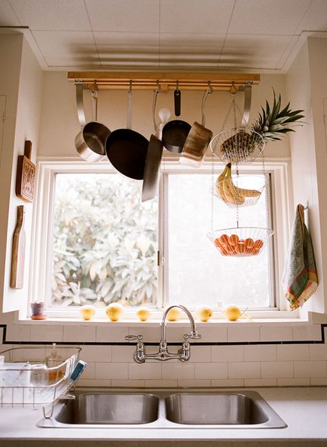 pots and frying pans hang from ceiling Pot Rack Over Window, Pot And Pan Holder Hanging, Overhead Pan Rack, Ceiling Pots And Pans Holder, Kitchen Ceiling Rack, Kitchen Pot Storage, Pot Rack Above Sink, Pot Rack Hanging Over Island, Hanging Pots Kitchen