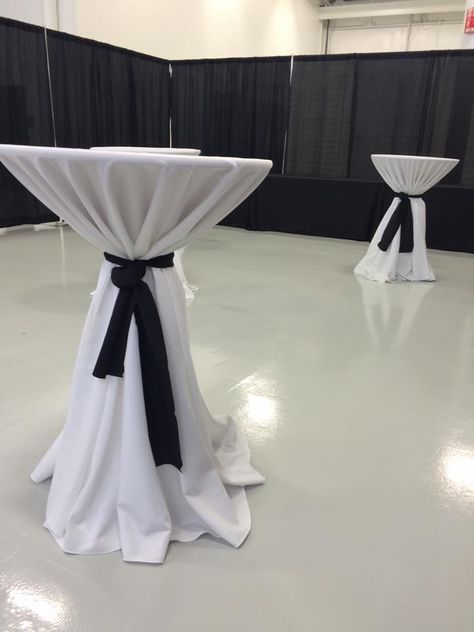 Our 30inch Cocktail table with a white linen and a black table runner to give it that elegant look Cocktail Table Decor, Highboy Table, Black Table Runner, White Cocktail Tables, Black Wedding Decorations, Black Tablecloth, Bow Party, Red Carpet Party, White Runners