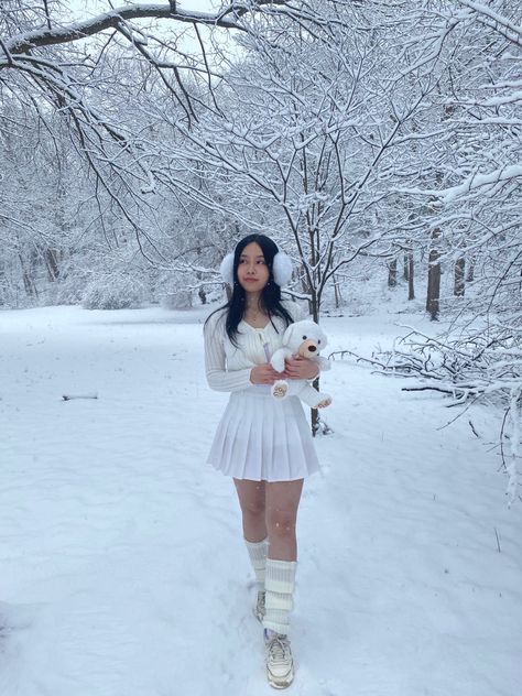 white cardigan, white leg warmers, white skirt, snow, white ear muffs, white sneakers insta: @/moondews White Cardigan And Skirt Outfit, White Winter Aesthetic Outfit, White Christmas Clothes, White Winter Skirt Outfit, White Sweater With Skirt, White Tennis Skirt Outfit Winter, Winter White Skirt Outfit, Snow White Aesthetic Outfit, White Fuzzy Sweater Outfits