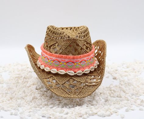 Cowboy Beach Hat - Peach Boho Band with Cowrie Shells - 100% Cotton Straw Natural Hand Woven Outdoor Breathable Gardening Hat Sturdy Box This is a comfortable cowboy hat to wear to the beach, concerts or rodeo. It's always ready to keep you shaded. Material: Durable natural woven straw Hat Size: US Hat Size 7 ¼ - 58-60cm 23 Inches Hat Crown: 12cm Hat Brim: 8cm Color: Natural Size fits up to 23 inches 58-60 CM, Country Style Woven Hats For Festivals, Western Handwoven Straw Hat For Festival, Bohemian Pink Hat Band For Beach, Natural Straw Hat For Festival, One Size Fits Most, Beach Cowboy Hat, Pink Straw Hat For Rodeo, Summer, Gardening Hat, Spring Hats, Cowrie Shells