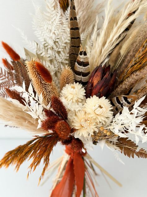 This Wedding Bouquets item by Fernandsunpalm has 446 favorites from Etsy shoppers. Ships from Laguna Beach, CA. Listed on Sep 20, 2024 Dried Flower Bouquet Wedding, Small Bridal Bouquets, Feather Bouquet, Bouquet Bride, Bridesmaids Bouquet, Pheasant Feather, Boho Wedding Flowers, Fall Flower Arrangements, Bride And Bridesmaids