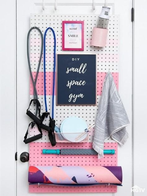 Jan 2, 2019 - The organization experts at HGTV.com show how to save space and still have a home gym with a DIY over-the-door pegboard workout station. Gym Organization Ideas Small Spaces, Pegboard Gym, Tiny Gym, Gym Corner, Workout Corner, Peloton Room, Homemade Gym, Small Home Gyms, Exercise Space