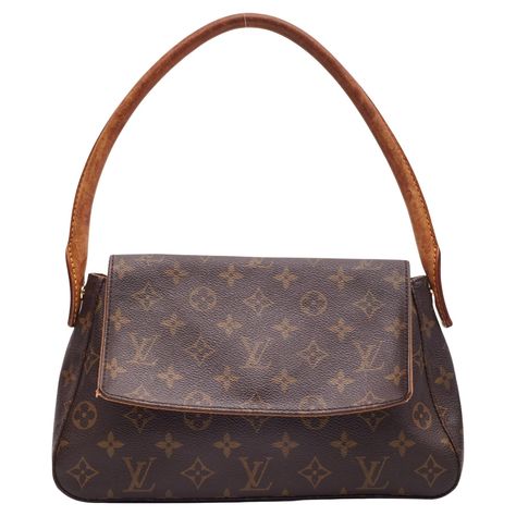 This Louis Vuitton Looping Bag is made with brown canvas with monogram print. The bag feature vachetta leather trim, gold toned hardware, a looping rolled leather top handle, a front flap with magnetic snap closure and a brown woven fabric interior lining with a single interior zip pocket. Vintage. Color: Brown monogram print Material: Coated canvas with vachetta leather details Date code: MI0072 Year: 2002 Made in France Size PM Measurements~ Height 7” Width 11” Depth 3.5” Shoulder strap drop: Louis Vuitton Flap Bag, Lv Shoulder Bag Outfit, Vintage Louis Vuitton Bag, Louis Vuitton Vintage Bag, Shoulder Bag Outfit, Lv Shoulder Bag, Vintage Designer Bags, Vintage Chanel Bag, Louis Vuitton Vintage