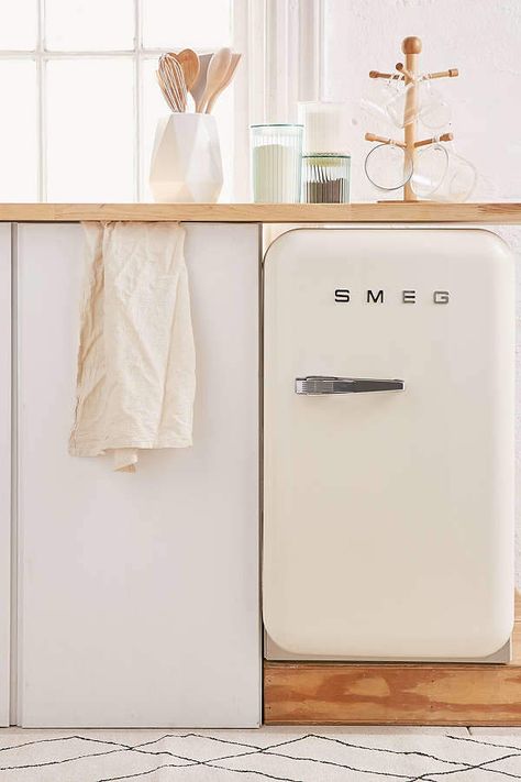 SMEG Mini Refrigerator Perfectly retro mini fridge with all the modern updates you need. Features absorption cooling for ultra-low noise level, LED interior lighting, a freezer tray for ice + plenty of shelving options. Perfect for additional storage + style wherever you need it. Not for use outside the United States and Canada. Apartment ideas #ad #kitchen Smeg Fridge, Anniversary Decoration, Mini Refrigerator, Luxury Decoration, Outdoor Kitchen Appliances, Farmhouse Side Table, Decoration Idea, Office Decoration, Outdoor Kitchen Design