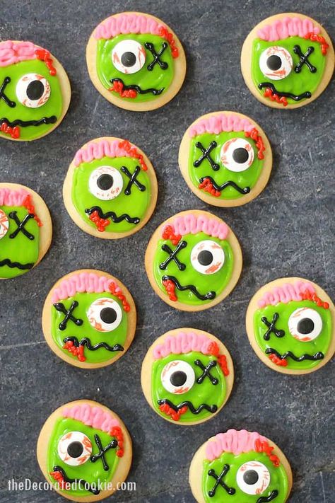 ZOMBIE COOKIES: Fun Halloween party treat with video how-tos. How to decorate cut-out sugar cookies with royal icing and candy eyes to make ZOMBIES! Zombie Cookies, Halloween Eats, Spooky Sweets, Halloween Sugar Cookies Decorated, Pasteles Halloween, Postres Halloween, Halloween Cookie Recipes, Halloween Party Treats, Halloween Cookies Decorated