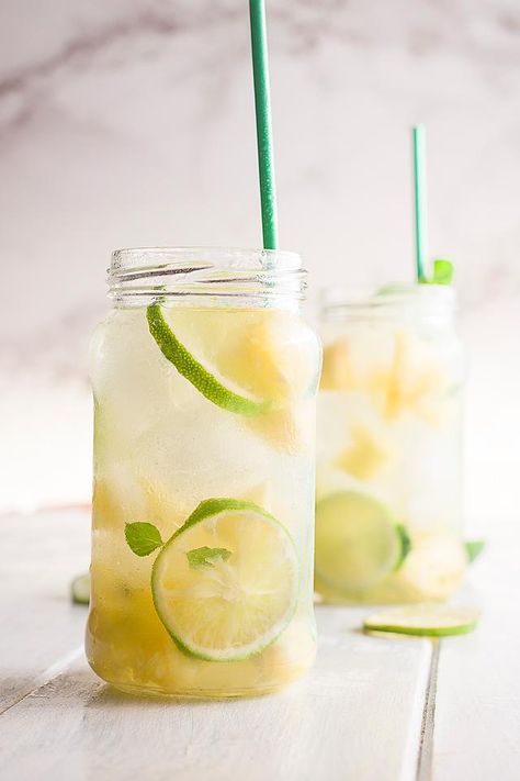 The flavour of this pineapple ginger mojito mocktail is so good. This refreshing non-alcoholic drink is brimming with tropical flavours. It’s the kind of drink I associate with fun vacations in the sun! This pineapple ginger mocktail would be great for any occasion. It’s super easy to throw together, and it really does taste impressive. This is an easy pineapple mojito recipe that is perfect for warm summer days. #mocktail #cocktail #summerdrink #tropicaldrink #mojito #pineapple #drinkrecipe Pineapple Mocktails, Spanish Drinks, Ginger Mocktail, Summer Mocktail Recipes, Ginger Mojito, Aqua Fresca, Non Alcoholic Mojito, Summer Mocktail, Fun Vacations