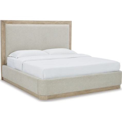 Get the luxe modern contemporary design you love at an affordable price. The Hennington queen upholstered panel bed features a structured silhouette on a plinth base that elevates the piece to a modern masterpiece. Soft yet still sleek in design, this bed's side rails and footboard are cushioned and have rounded ends. The textural surface of the bisque-colored wood pairs beautifully with the neutral upholstery. Wood And Upholstered Bed, Ashley Bedroom, Bed Side Rails, Master Closet Design, Modern Upholstered Beds, Modern Headboard, Transitional Furniture, King Upholstered Bed, Queen Upholstered Bed