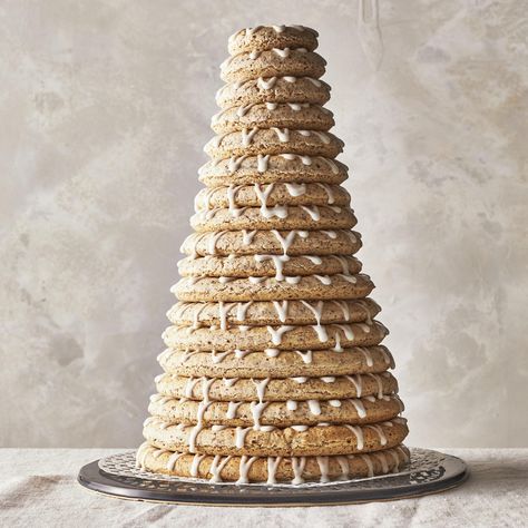 Kransekake (Norwegian Almond Ring Cake) Norwegian Deserts, Norwegian Kransekake, Kransekake Recipe, Almond Ring, Norwegian Cookies, Poured Icing, Norwegian Culture, Norwegian Recipes, Vegan Xmas