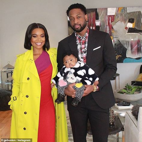 Handsome family: Dwyane was dressed to impress wearing a plaid shirt layered underneath a ... Cute Celebrity Couples, Vibrant Dress, Yellow Coat, Dwyane Wade, Celebrity Families, Gabrielle Union, Jennifer Love Hewitt, Catherine Zeta Jones, Celebrity Babies