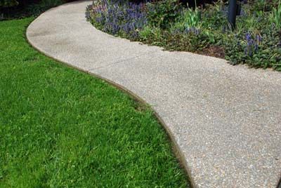 exposed aggregate concrete walkway Front Yard Walkway, Exposed Aggregate Concrete, Aggregate Concrete, Concrete Path, Courtyard Landscaping, Exposed Aggregate, Pathway Landscaping, Concrete Walkway, Front Walkway