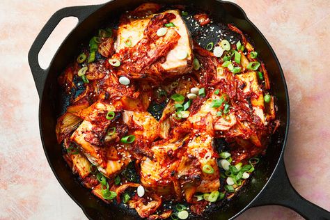 NYT Cooking: Sautéing kimchi brings out its mellower side: a delicious, cabbage-y sweetness. In Korean cuisine, stir-fried kimchi (kimchi-bokkeum) is a classic staple served with rice. In this recipe, the kimchi is cooked in a fragrant mix of butter and toasted sesame oil along with just a touch of sugar, making a four-ingredient seasoning and sauce for salmon filets. Often, jarred cabbage kimchi is already ch Salmon And Kimchi Skillet, Salmon And Kimchi, Salmon Kimchi Bowl, Salmon Kimchi, Stir Fry Kimchi, Fire Chicken, Cleaner Eating, Sauce For Salmon, Kimchi Recipe