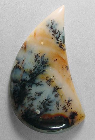 Paiute agate. Usually a massive, black and white to light yellow brown, dendritic agate in nearly opaque matrix. Luxury Polished Agate Jewelry, Coyamito Agate, Nature-inspired Agate Cabochon Necklace, Biggs Jasper, Vintage Agate Gemstone Cabochons, Handmade Vintage Agate Beads, Gems, And Cabochons, Montana Agate, Dendritic Agate, Gemstone Cabochons