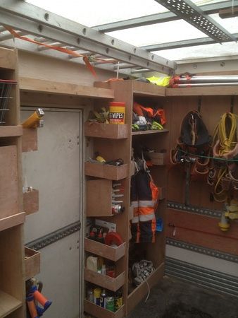 storage shelves over top of the door Trailer Storage Ideas Construction, Cargo Trailer Organization Shelves, Dewalt Tool Storage Trailer, Cargo Van Tool Storage Ideas, 6x12 Cargo Trailer Shelves, Construction Trailer, Trailer Shelving, Work Truck Organization, Tool Trailer