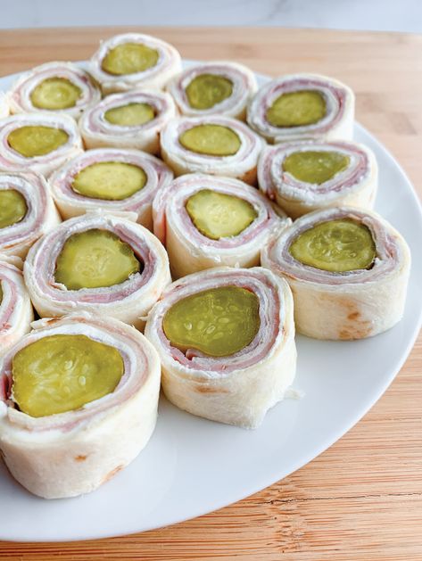 The BEST party appetizer. Why, you ask? Because it's easy (30 minutes or less), only a handful of ingredients and these tortilla rollups are a crowd-pleaser! #appetizer #partyfood #pickle #ham #creamcheese #tortillas Ham And Pickle Roll Ups, Ham And Pickle, Pickle Roll Ups, Halloween Fingerfood, Finger Foods For Kids, Homemade Ham, Party Snacks Easy, Appetizers For Kids, Roll Ups Recipes