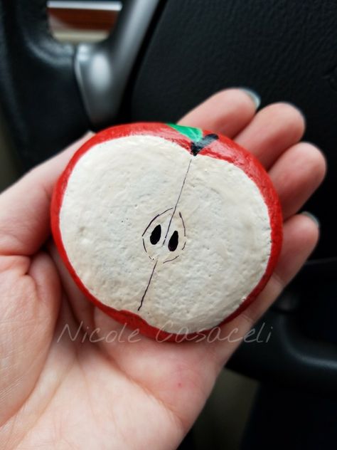 Apple painted rock, teacher appreciation week. #paintedrocks #kindnessrocks Slice Of Pie Painted Rock, Apple Painted Rock, Apple Rock Painting, Pizza Rock Painting, Food Painted Rocks, Rocks Painted Like Food, Food Rock Painting Ideas, Painted Garden Rocks, Apple Painting