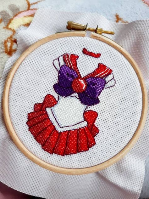 .✫*ﾟ･ﾟ｡.☆.*｡･ﾟ✫*. MARS POWER, MAKE-UP! .✫*ﾟ･ﾟ｡.☆.*｡･ﾟ✫*. A PDF cross stitch pattern of Sailor Mars first Sailor Suit.. In a Deluxe edition - a larger pattern with much more detail! Size - 55 x 75 stitches Colours - 8 Aida - I used 20 count fabric in mauve to help contrast the white threads. PDF Random Diys, Moon Cross Stitch Pattern, Kawaii Cross Stitch, Moon Cross Stitch, Arte Sailor Moon, Sailor Suit, Beaded Cross Stitch, Sailor Mars, Needlepoint Patterns