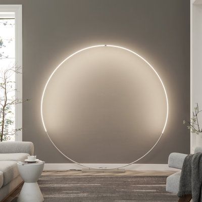 Experience the awe-inspiring beauty of minimalist design with our oversized, brilliantly luminous circular LED floor lamp—a true centrepiece for any space. Crafted from durable metal with a sleek metallic finish, this lamp is crowned by an aluminium and acrylic diffuser. However, its standout feature lies in its gracefully curved and delicately slim silhouette. Perfect for positioning behind a sofa, along a foyer wall, or even in the master bedroom, it exudes an ultra-modern vibe. This circular Lighting In The Living Room, Creative Bedroom Lighting, Podcast Decor, Wall Behind Sofa, Lavender Milk, Foyer Wall, Light Inspiration, Family Room Remodel, Novelty Floor Lamp