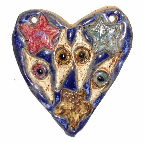 Heart of Eyes and Stars #ceramics #ceramicart #ceramicartist #clayart #clayartist #artoninstagram #artistoninstagram #instaart #heart Aberrant Ceramics, Stars Wall Art, Ceramic Star, Ornament Wall, Star Wall Art, Ceramic Artwork, Ceramic Heart, Clay Art Projects, Heart Ornament