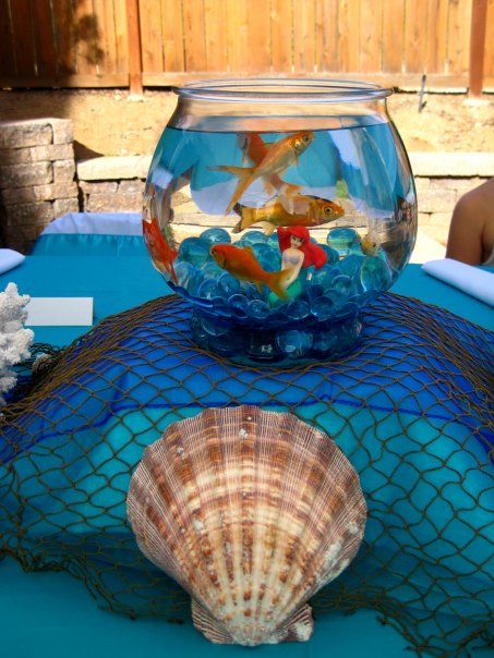 17852_1307581859438_1527315421_823371_1441129_n Real Fish Centerpiece Ideas, Fish Bowl Centerpiece Birthday, Finding Nemo Table Centerpieces, Finding Nemo Centerpieces Ideas, Goldfish Centerpiece, Little Mermaid Centerpieces, Fishbowl Centerpiece, Blue Marbles, Pirate Mermaid