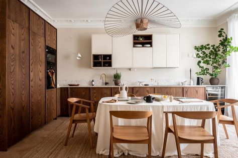 This gorgeous turn-of-the-century home (styled by Emma Fisher and Annica Clarmell, photographed by Henrik Linden for Alvhem) has a connected kitchen and living room, with a historic double interior door in the middle of the spaces. The two-tone kitchen has … Continue reading → Peach Living Rooms, Dark Oak Cabinets, Beige Wall Colors, White Upper Cabinets, Wood Minimalist, Grey Wall Color, Living Room Wall Color, Room Wall Colors, Two Tone Kitchen