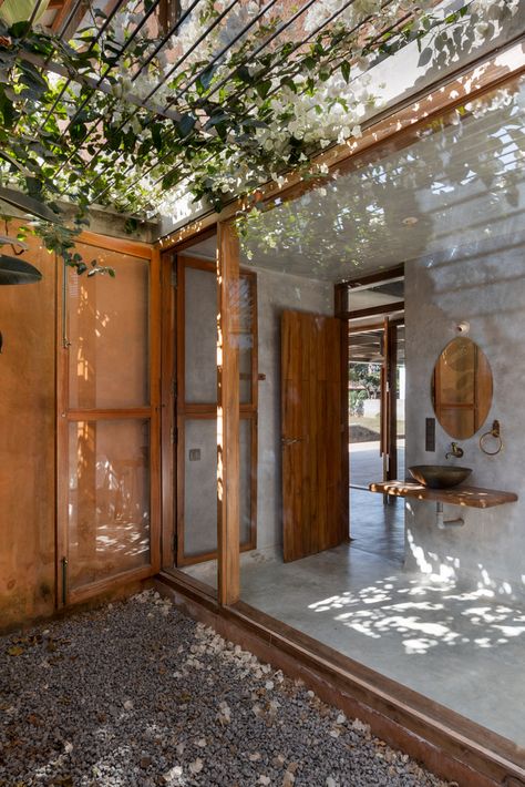 Gallery of House of Earth and Stone / STUDIO MOTLEY - 5 Outdoor Toilet And Shower Ideas, Outside Bathtub, Outdoor Toilet And Shower, Architectural Doors, Apartment Designs, Indoor Outdoor Bathroom, Outdoor Bathroom Design, Sliding Folding Doors, Wood Staircase