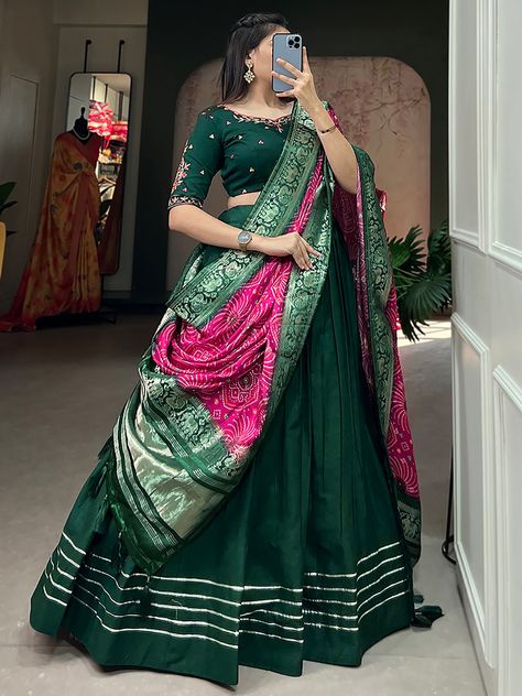 Introducing our adorable green cotton festival wear a plain lehenga choli with a dupatta, a flawless beauty that exudes grace and elegance. Crafted with utmost care and attention to detail, this traditional ensemble is a treasure trove of vintage brilliance with a modern twist. Ideal for festivals, events, and occasions, this stunning lehenga choli is a must-have addition to your ethnic wardrobe.
Made from premium quality cotton material in a vibrant green color, this lehenga is adorned with exq Green Colour Lehenga Designs, Chaniya Choli Draping Styles, Chaniya Choli Dupatta Draping Style, Navratri Duppata Style, Choli Color Combinations, Green Ghagra Choli, Plain Lehenga Choli, Dark Green Lehenga, Rajasthani Lehenga