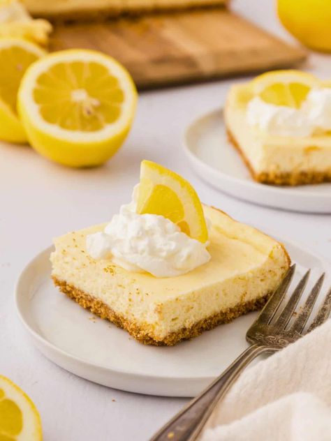 Lemon Cheesecake Bars are the ultimate spring dessert recipe! Made with fresh lemons, cream cheese, sour cream, and a graham cracker crust, these sweet and tangy lemon cream cheese bars are the perfect treat for anyone who loves lemon and cheesecake! Lemon Cream Cheese Bars, Cheesecake Bars Easy, Cheesecake Bar, Cheese Bars, Spring Recipes Dessert, Lemon Cheesecake Bars, Cream Cheese Bars, Spring Dessert, Lemon Cream Cheese