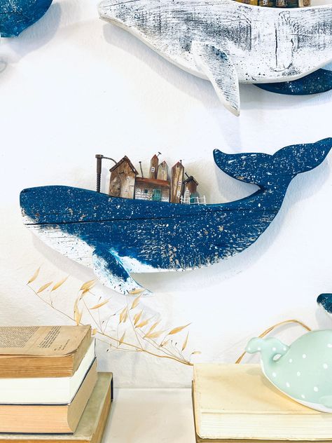 Hey👋 thanks for stopping by 🙂   Big blue reclaimed wood whale, small cottage on whale.Unique, handmade and love made wooden whale wall decoration with small village houses from driftwood and pieces i reuse. Dimensions 50x25 cm  If you need custom size please contact me. Please note that every piece that I make is one-of-a-kind and all pieces can be customized or personalized. Due to the nature of the matterials used, the grain, color and overall surfaces might slightly differ from piece to piece. If you want something made especially for you, you can send me a message and I will make it into a custom order to fit your needs  I'm Sofia and these are my handmade stories! I love to create, remake and reuse old wooden objects. Nature is my big inspiration. I'm from Thessaloniki, Greece and I Driftwood Whale, Whale Wall Decor, Whale Sign, Wood Whale, Collection Board, Whale Decor, Whale Wall Art, Wooden Whale, Rustic Window