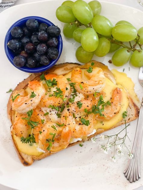 White plate with cajun shrimp toast sliced down the middle to show runny egg and hollandaise sauce. Blueberries, grapes on the plate. Plate is also dressed with babies breath for garnish. Sausage Breakfast Pizza, Hollandaise Recipe, Recipe For Hollandaise Sauce, Shrimp Toast, Perfect Poached Eggs, Shrimp Sauce, Grilled Bread, Toast Toppings, Shrimp Seasoning