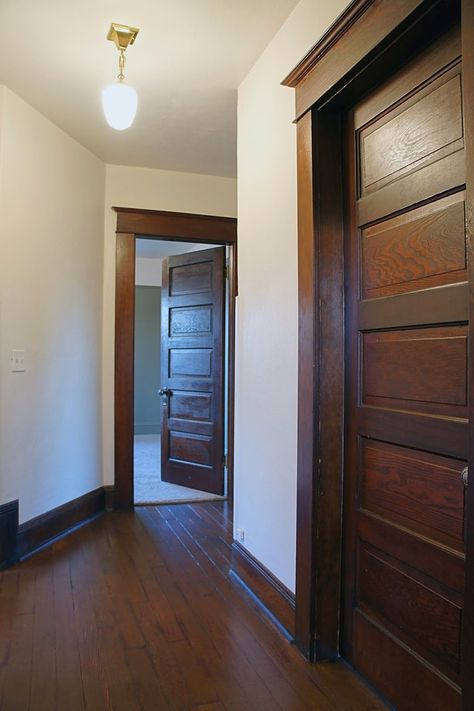 White Craftsman Interior, Craftsman Foursquare, Craftsman Interior Door, Interior Doors Stained, Dark Woodwork, Wood Hallway, Pintu Interior, American Foursquare, White Interior Doors