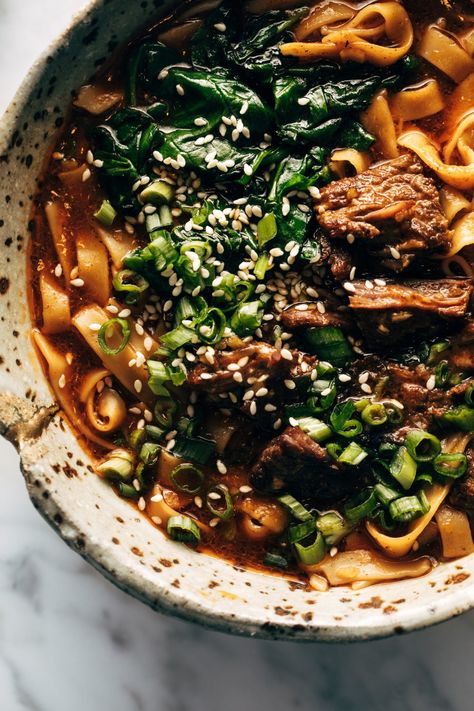 Instant Pot Spicy Short Rib Noodle Soup! We're making a stop in Noodle Town! This noodle-y wonder is packed with tender short ribs, bright sautéed spinach, sesame seeds, and gingery broth, and noodles upon noodles. #shortribs #noodlesoup #instantpot Broth And Noodles, Oven Roasted Mushrooms, Pinch Of Yum, Pot Noodle, Noodle Soup Recipe, Beef Noodle Soup, Short Rib, Roasted Mushrooms, Sauteed Spinach