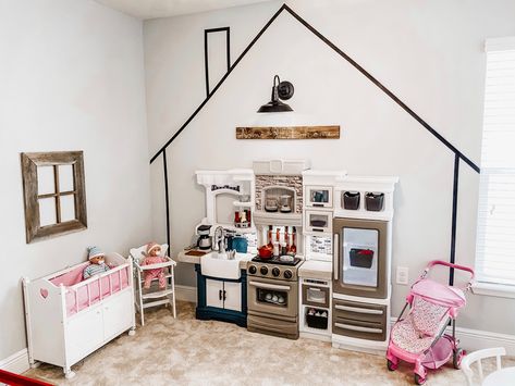 IG-@blissfully_the_bensons #playroom #playroomgoals #playroomideasonabudget #kidsplayhouseplans #pretendplay Home Corner Playroom, Paint House On Wall Playroom, Role Play Playroom, Playroom Decal Ideas, Playroom Zones Play Areas, House On Wall Playroom, Pretend Town Playroom, Tiny Town Playroom, House Outline On Wall Playroom