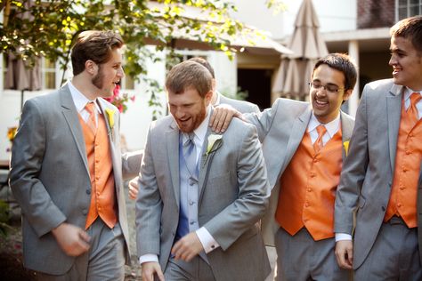 Grey suits. Groom in silver vest (classy), and groomsmen in tangerine (fun). Calla lily boutonnieres. Grey And Orange Suit, Silver Vest, Calla Lily Boutonniere, Suits Groom, Grey Suits, Orange Suit, Tangerine Dream, Grey And Orange, Great Photographers