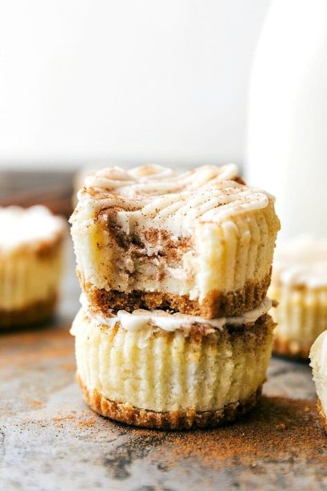 Miniature Cinnamon Roll Cheesecakes - Chelsea's Messy Apron Cheesecake Cinnamon, Roll Cheesecake, Cinnamon Cheesecake, Sugar Cookie Cups, Cinnamon Roll Cheesecake, Mini Cheesecake Recipes, Cream Cheese Topping, Cheesecake Bites, Mini Cheesecakes