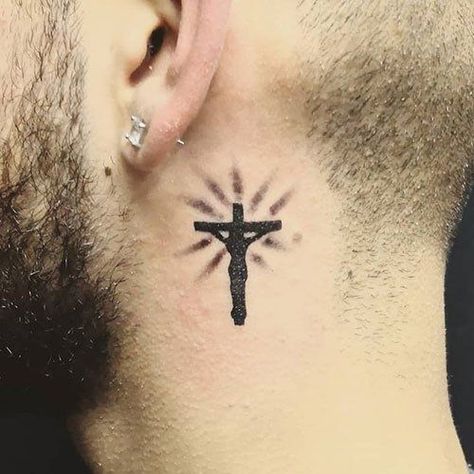 Cross neck tattoos are one of the most popular choices out there and they have a strong religious meaning as it reminds everyone that your religion is the most important thing in your life. White Tattoo Cross, Cross Tattoo Neck, Cruces Tattoo, Hals Tattoo Mann, Tato Salib, Small Cross Tattoos, Small Cross Tattoo, Best Neck Tattoos, Small Neck Tattoos