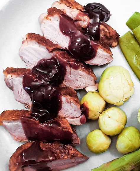 Slices of crispy roast duck covered with cherry sauce on a plate with vegetables. Duck With Cherry Sauce, Holiday Sauce, Cherry Sauce Recipe, Balsamic Cherries, Roasted Duck Recipes, Duck Breast Recipe, Duck Recipe, Crispy Roast Potatoes, Cherry Sauce