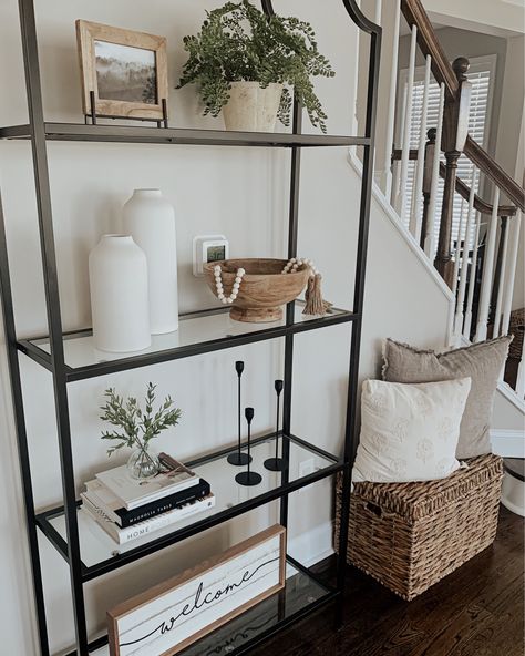 Black Book Case Decor, Four Shelf Bookshelf Decor, Bookshelf Decor Boho, Glass Bookcase Decor, Two Story Home Decor Ideas, Round Bookshelf Decor, Home Decor Shelf Ideas, Styling Glass Shelves Living Room, Farmhouse Living Room Accessories