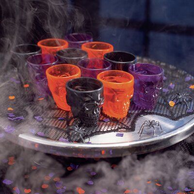 Planning a Halloween party for adults? Don't forget the Halloween shot glasses! A must-have addition to any boo bash, this tableware is unique, eye-catching, and will make your drinks table the centerpiece of the party. You and your guests will love the clever design and classic seasonal colors! The skull design is featured on both sides of the shot glass. | The Holiday Aisle® Niota 12 Piece 2 oz. Plastic Shot Glass Set Plastic, Size 2.25 H x 2.25 W in | Wayfair Halloween Party For Adults, Candy Table Signs, Halloween Shot Glasses, Party For Adults, Halloween Shots, Halloween Candy Bar, Halloween Party Drinks, Boo Bash, Hallowen Party