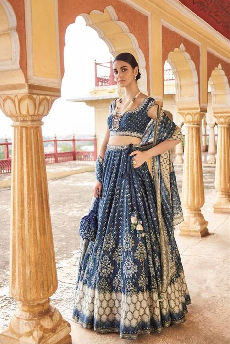 Wearing a blue bridal lehenga for your big day? These blue bridal lehengas will up your glamour quotient. The unique lehenga is in huge demand nowadays. Take cues from these designer lehenga. #blue #bluelehenga #bluecoloredoutfits #bluedresses #bridalehenga #bluebridallehenga #indianbrides #indianwear #bridalwear #Lehengadesigns #lehengainspiration Anita Dongre Lehenga, Pink Bridal Lehenga, Silk Lehenga Choli, White Lehenga, Indian Outfits Lehenga, Party Wear Lehenga Choli, Bollywood Lehenga, Lengha Choli, Anita Dongre