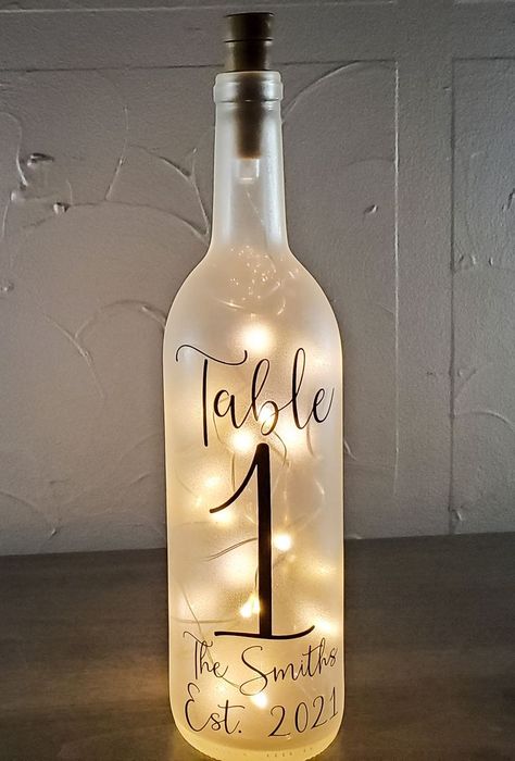 These beautiful wine bottle light table numbers are a unique way to ensure your guests can quickly and easily find their seats, ensuring your special day runs smoothly. The bottles are double-sided so your guests can better see the table numbers no matter where they are. Looking for something different? Please visit my shop to view my full selection: www.etsy.com/shop/ShopFireflyHome Bottle Lights Wedding, Wine Bottle Table Numbers Wedding, Bayou Wedding, Wine Bottle Table, Wine Bottle Lights, Table Numbers Wedding Diy, Wine Bottle Light, Lights Wedding, Lighted Wine Bottles