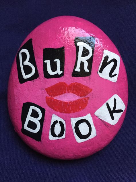 Mean Girls Burn Book Painting Ideas, Mean Girls Pumpkin Painting, Y2k Rock Painting, Cute Burn Book Ideas, Rock Painting Ideas Taylor Swift, Cute Painted Rocks Ideas, Mean Girls Drawing, Rock Painting Ideas Easy Aesthetic, Preppy Rock Painting