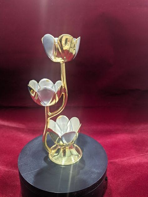 Pure silver tulip stand with gold coat. This stand can be used for haldi, kumkum, sandalwood powder ,etc Measurements - Length - 6 inches Weight - Approximately 65 to 66 gms 92.5 pure silver This product can be a return gift for any occasion like housewarming/Babyshower/Pooja/ Navratri/Diwali /Ganesh puja/ Tambulam / etc. Solar System Science Project, Haldi Kumkum, Ganesh Puja, Gold Coat, Sandalwood Powder, Pooja Items, Silver Pooja Items, Silver Items, Return Gift