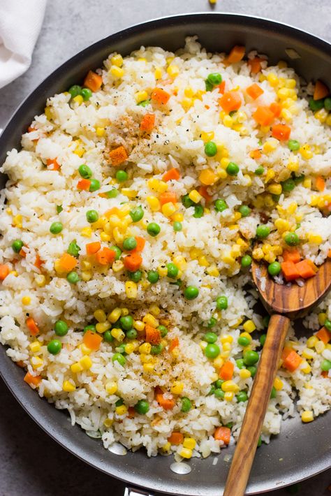 Tender fluffy jasmine rice with carrots, corn, peas, and little bit of cayenne pepper. It’s my mom’s recipe that goes with just about any main dish. It’s so simple, yet so good! Finally sharing my mommas recipe. This Mexican rice with veggies was one of my favorite sides she would make. It goes with chicken, beef, shrimp,...Read More » :: Food Rice With Corn Recipe, Broken Rice Recipe, White Rice With Corn, Mexican White Rice, Rice Recipes Side, Rice With Corn, Jasmine Rice Recipes, Mexican Rice Recipes, Rice Side Dishes