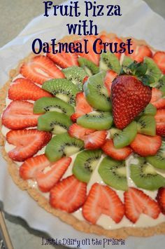 The recipe for this amazing fruit pizza came out of and Eagle Brand Sweetened Condensed Milk recipe book! Seriously, it's the best fruit pizza EVER! | Little Dairy on the Prairie Oatmeal Pizza, Fruit Oatmeal, Oatmeal Crust, Fruit Pizza Crust, Pizza Sugar Cookie, Pizza Dessert, Spring Time Desserts, Fruit Pizza Sugar Cookie, Sugar Cookie Crust