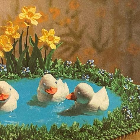 Jess on Instagram: "Ducklings Afloat on a Pond Cake (The Wilton Way of Cake Decorating, 1979) #vintagecookbooks#vintagefood#retrofood#weirdfood#vintagefoodstyling#oldcookbooks#cakedecorating#duckcake#ducklingcake#springcake#pondcake#vintagecake#retrocake#animalcake#1970s#1970sfood#1970scooking#1970scookbook#70scake#1970scake" 1970s Birthday Cake, Pond Cake, Vintage Animation, Box Cakes, Wilton Cakes, A Pond, Vintage Cookbooks, Bento Box Lunch, Vintage Cake