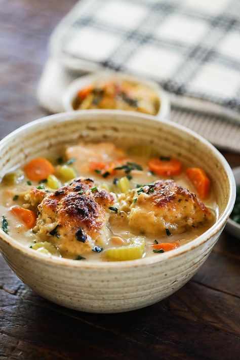 Easy Chicken and Dumplings - The best chicken and dumplings made with homemade biscuits on top of chicken soup with vegetables. A tasty comfort food dish to make this winter. The Best Chicken And Dumplings, Old Fashioned Chicken And Dumplings, Best Chicken And Dumplings, Easy Chicken And Dumplings, Soup With Vegetables, Office Meals, Chicken Dumpling Soup, Easy Home Recipes, Homemade Biscuits